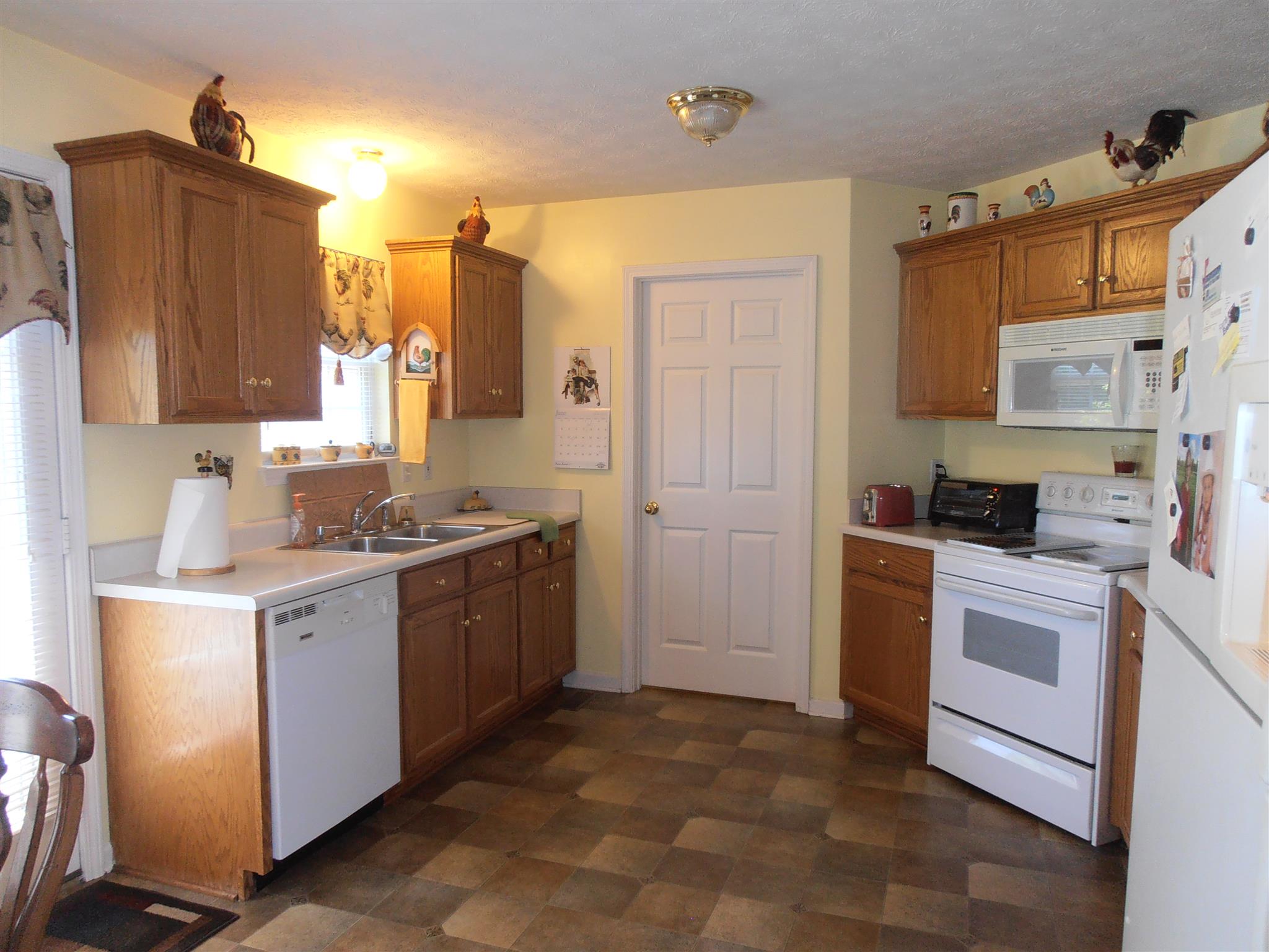 1141 Woods Ferry Road Lebanon, TN 37087 - Photo 12 of 30 a kitchen with a sink stove and refrigerator