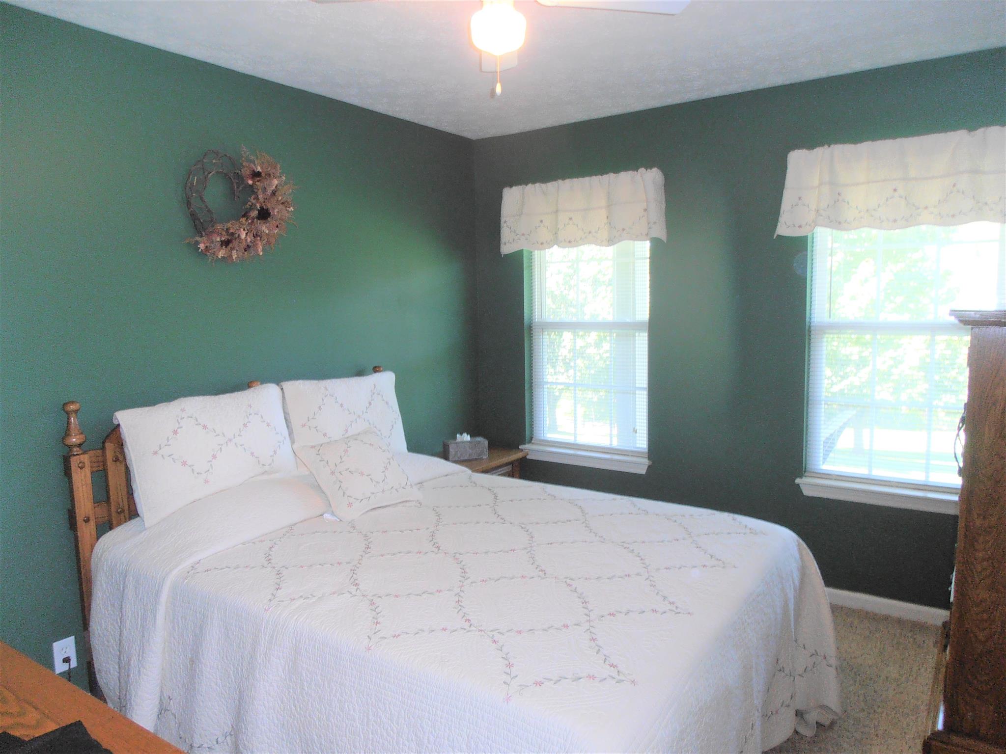 1141 Woods Ferry Road Lebanon, TN 37087 - Photo 18 of 30 a large white bed in a small room next to a window