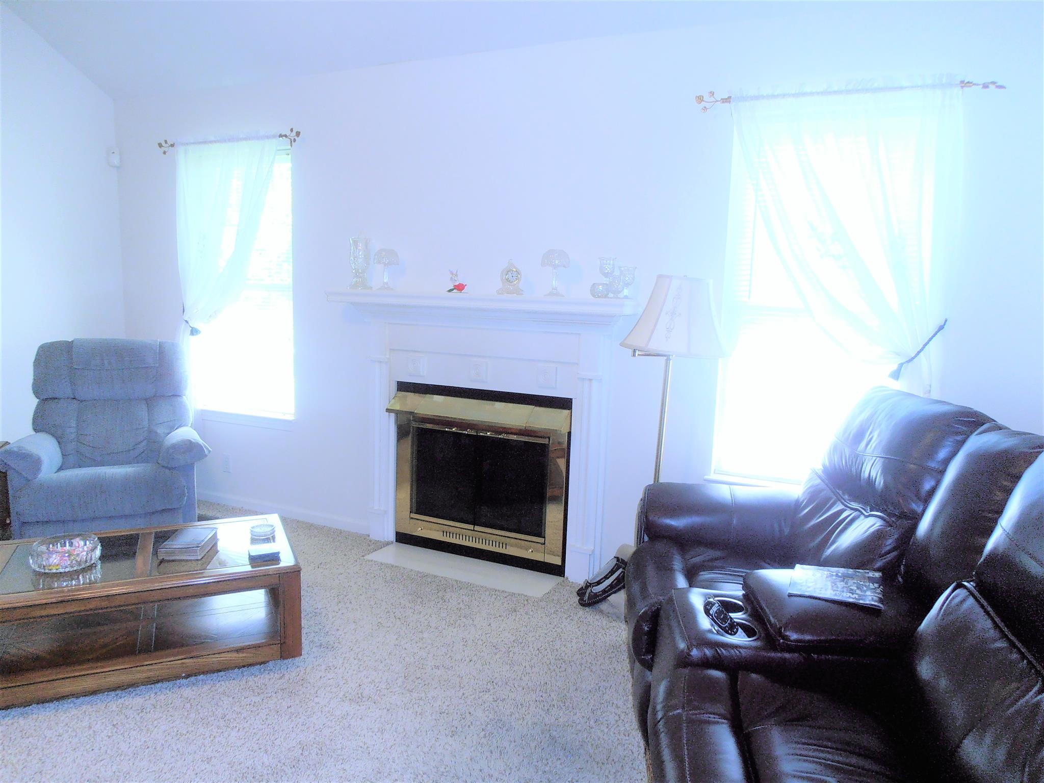 1141 Woods Ferry Road Lebanon, TN 37087 - Photo 8 of 30 a living room with furniture and a fireplace