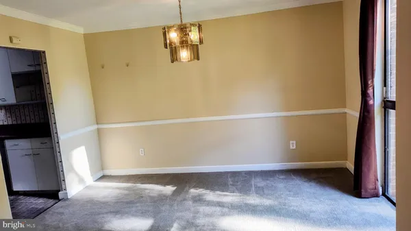 a view of an empty room with a fireplace