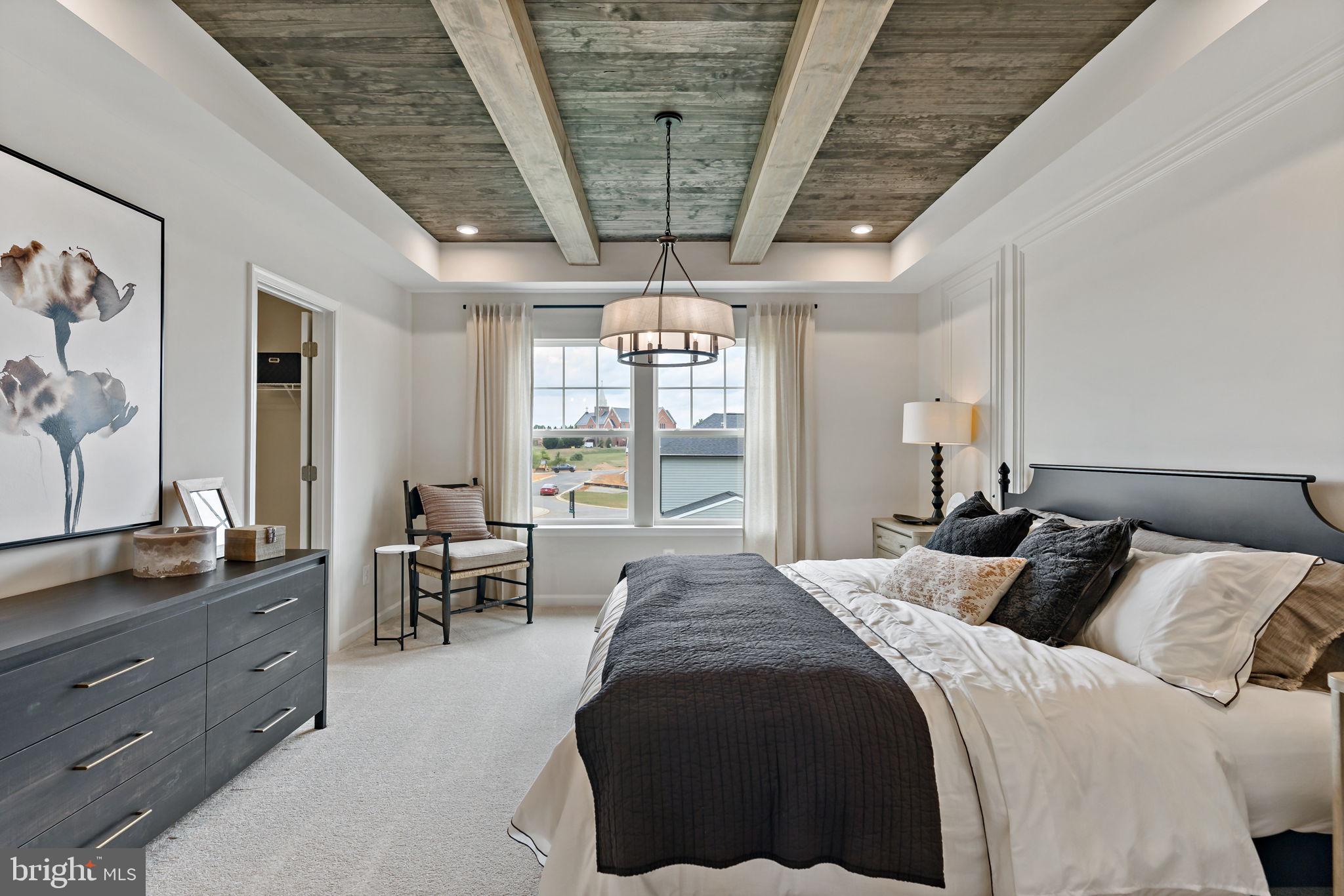 275 Nymph Road Inwood, WV 25428 - Photo 14 of 36 a spacious bedroom with a large bed and a window