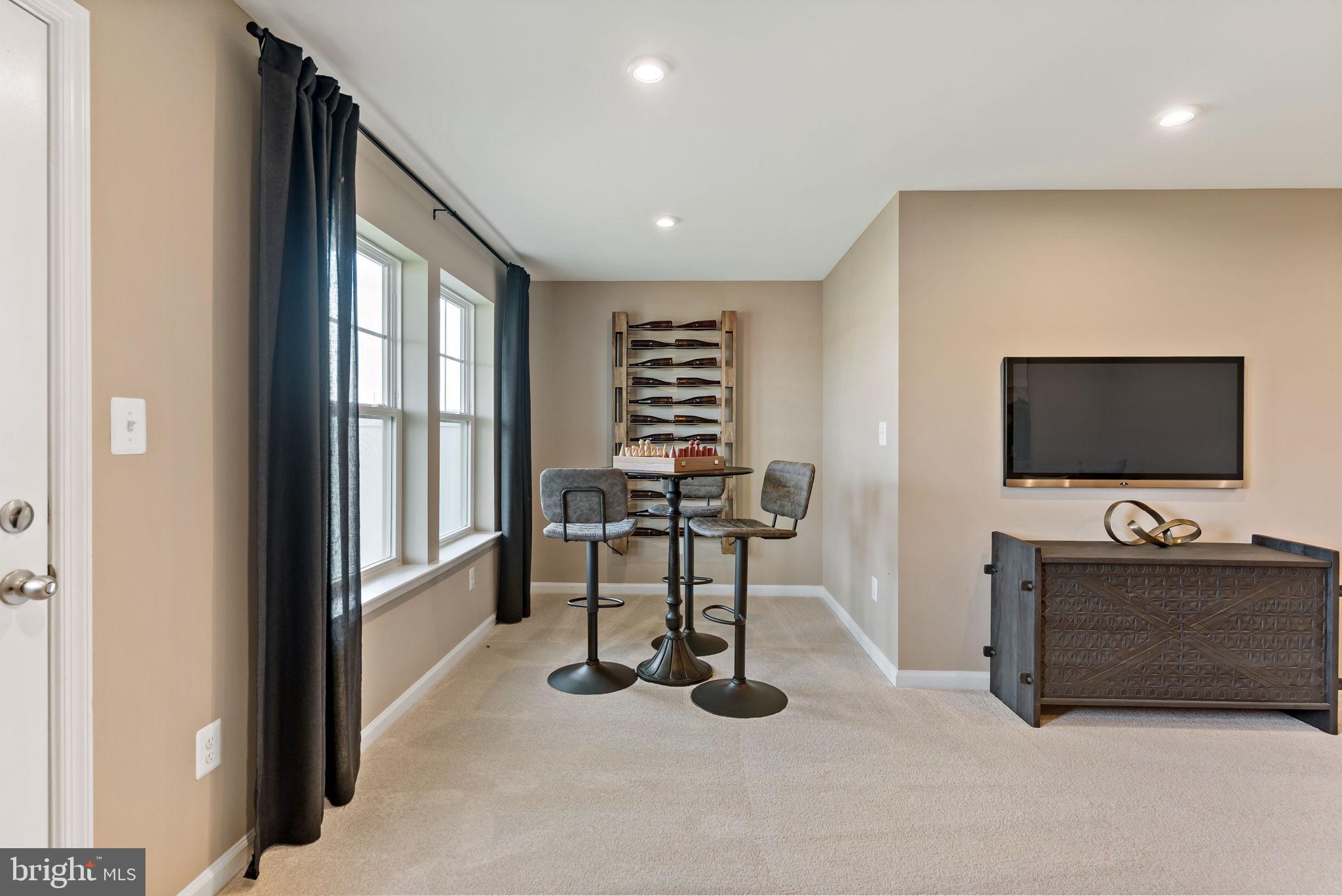 275 Nymph Road Inwood, WV 25428 - Photo 26 of 36 a view of a livingroom with furniture and a flat screen tv