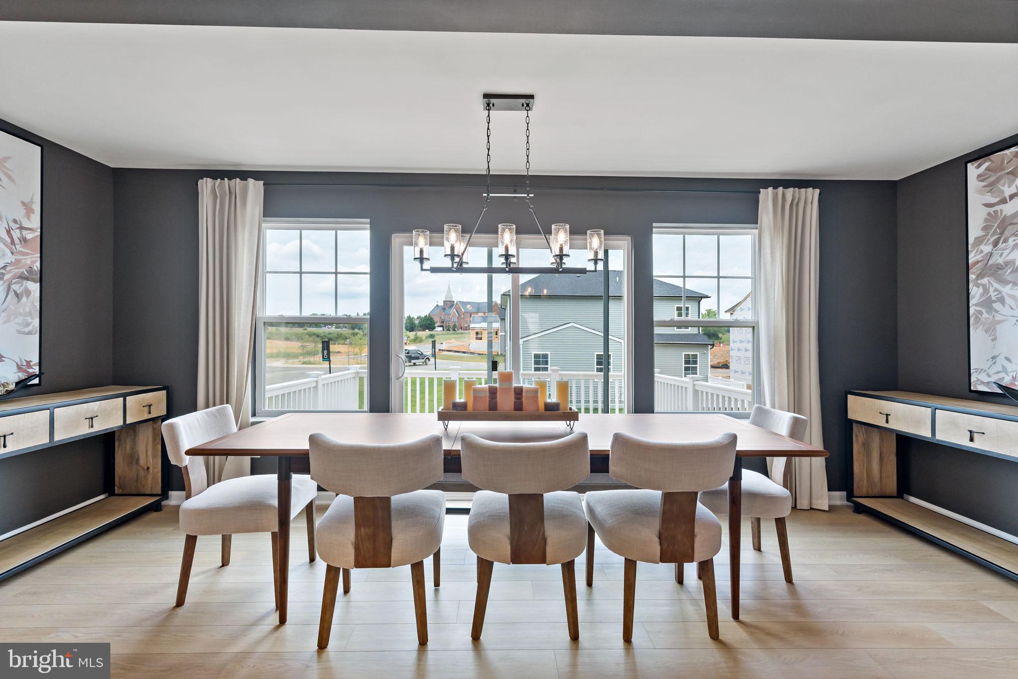275 Nymph Road Inwood, WV 25428 - Photo 8 of 36 a view of a dining room with furniture window and outside view