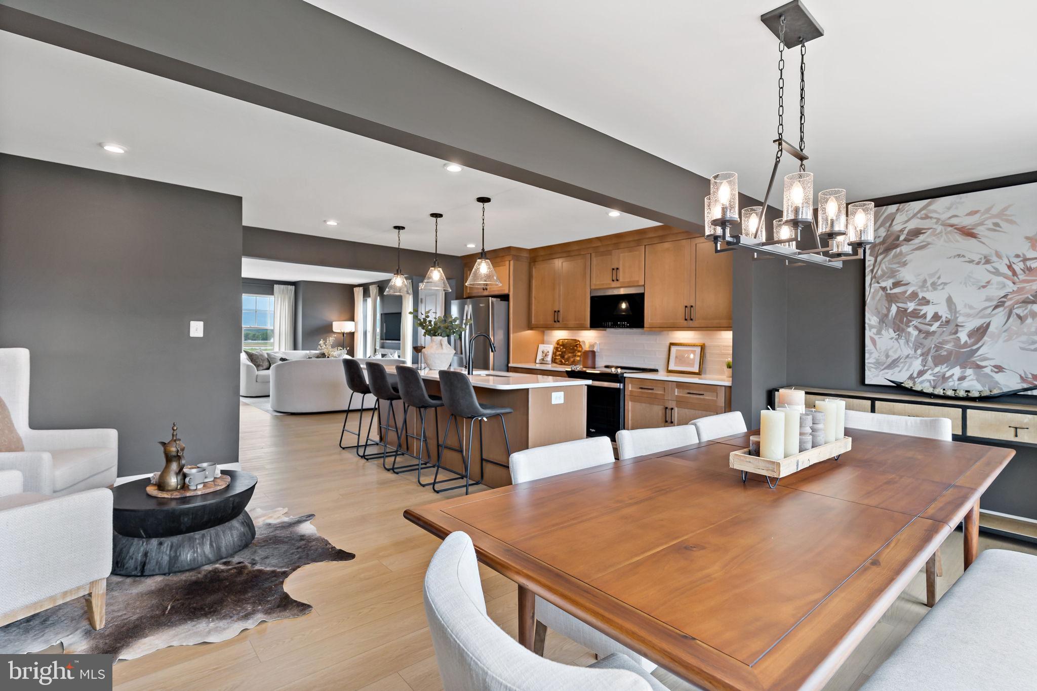 275 Nymph Road Inwood, WV 25428 - Photo 9 of 36 a kitchen with a dining table and chairs