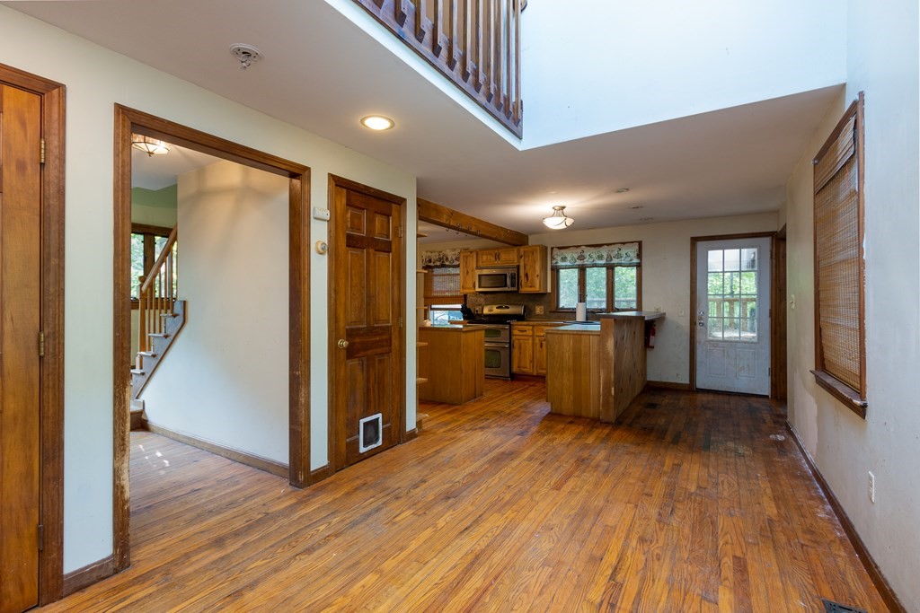 690 East Thompson Road Thompson, CT 06277 - Photo 8 of 16 a view of kitchen with furniture and wooden floor