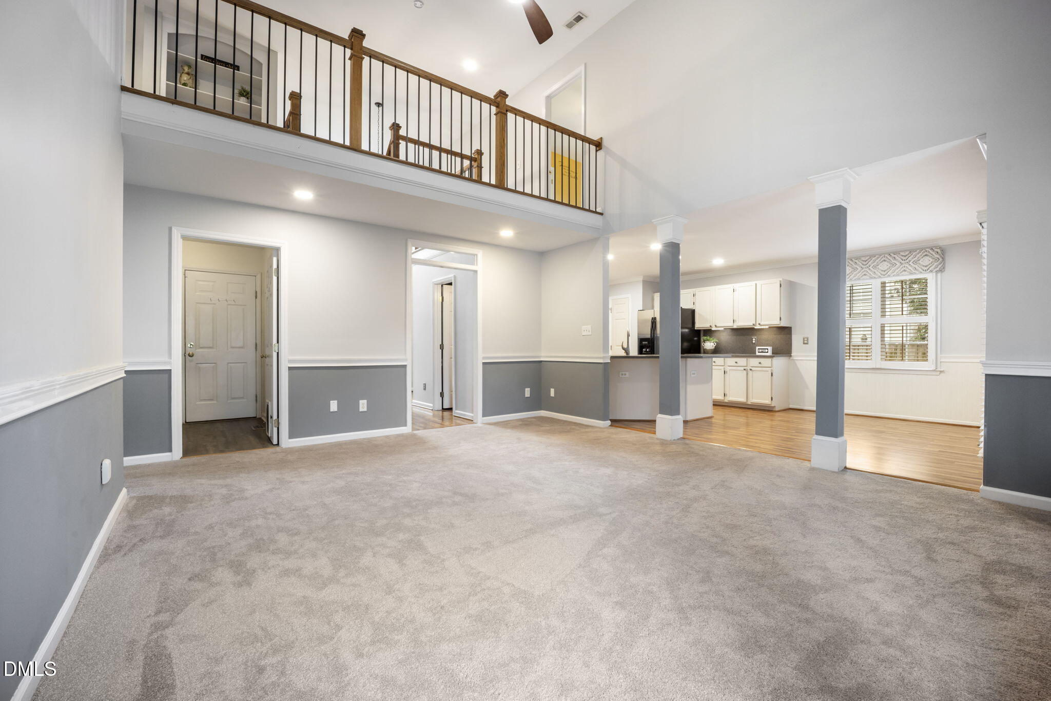 8665 Harps Mill Road Raleigh, NC 27615 - Photo 13 of 36 a view of an empty room and kitchen view