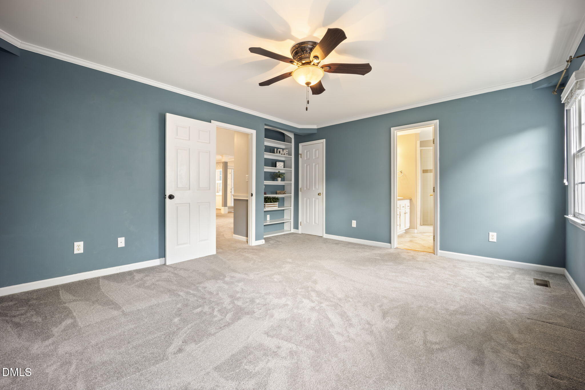 8665 Harps Mill Road Raleigh, NC 27615 - Photo 16 of 36 a view of an empty room with a ceiling fan and window
