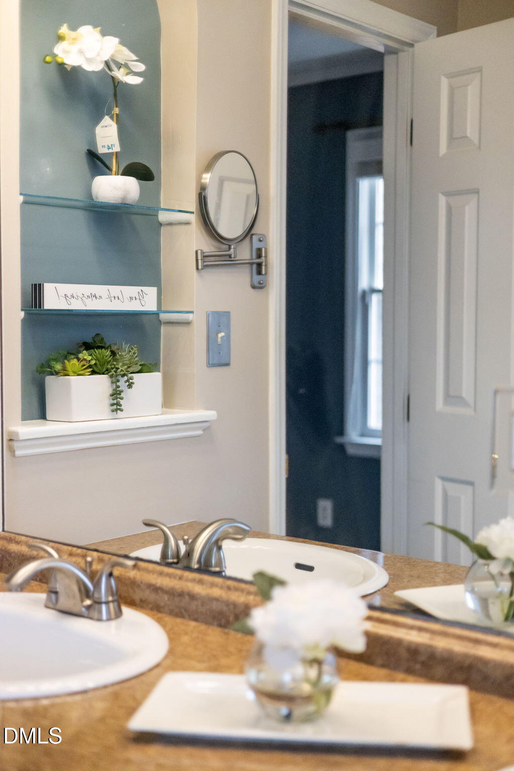 8665 Harps Mill Road Raleigh, NC 27615 - Photo 20 of 36 a bathroom with a sink and a mirror