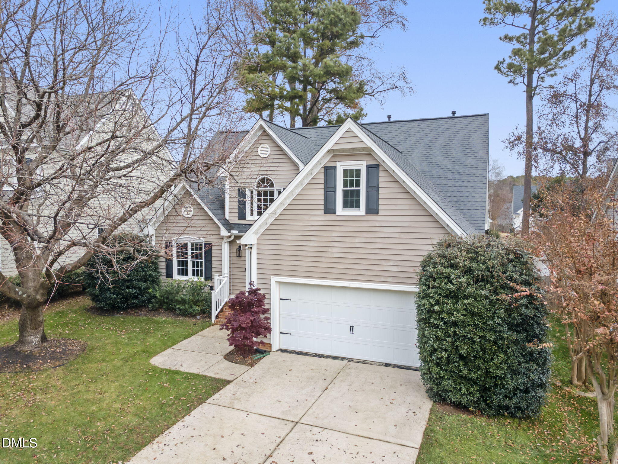 8665 Harps Mill Road Raleigh, NC 27615 - Photo 2 of 36 a view of a house with a yard
