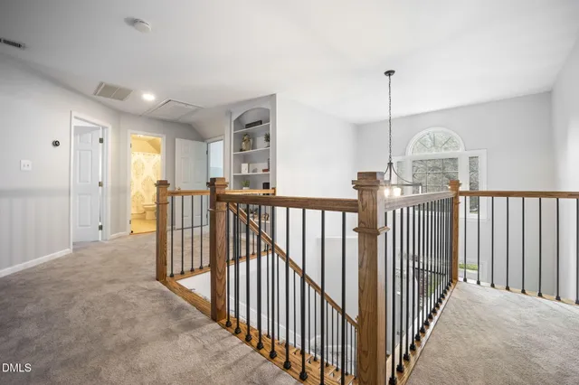 a view of a hallway with windows