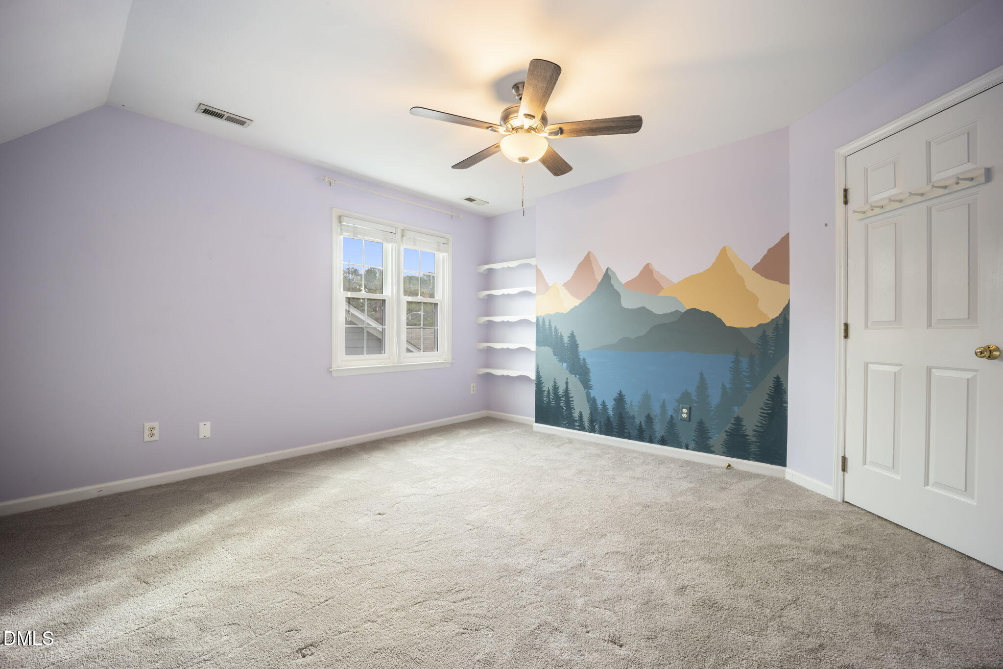 8665 Harps Mill Road Raleigh, NC 27615 - Photo 23 of 36 a view of a bedroom with a ceiling fan and a window