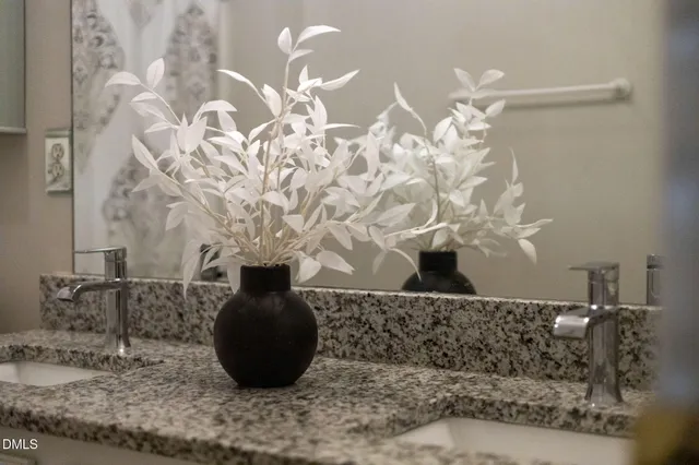 a vase of flowers sitting on a table