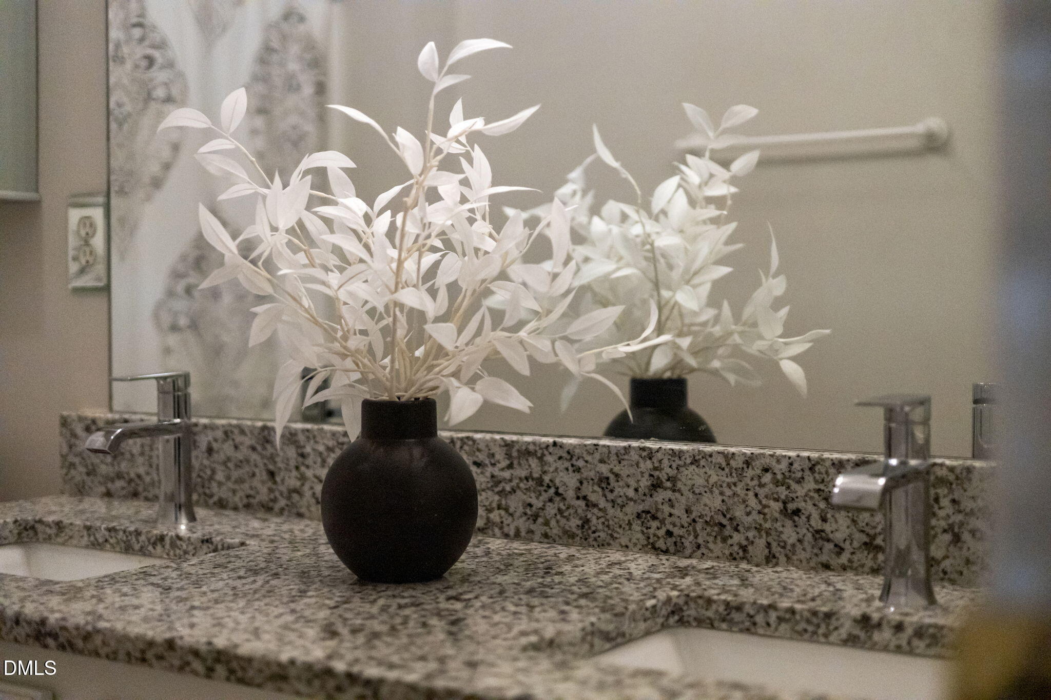 8665 Harps Mill Road Raleigh, NC 27615 - Photo 26 of 36 a vase of flowers sitting on a table