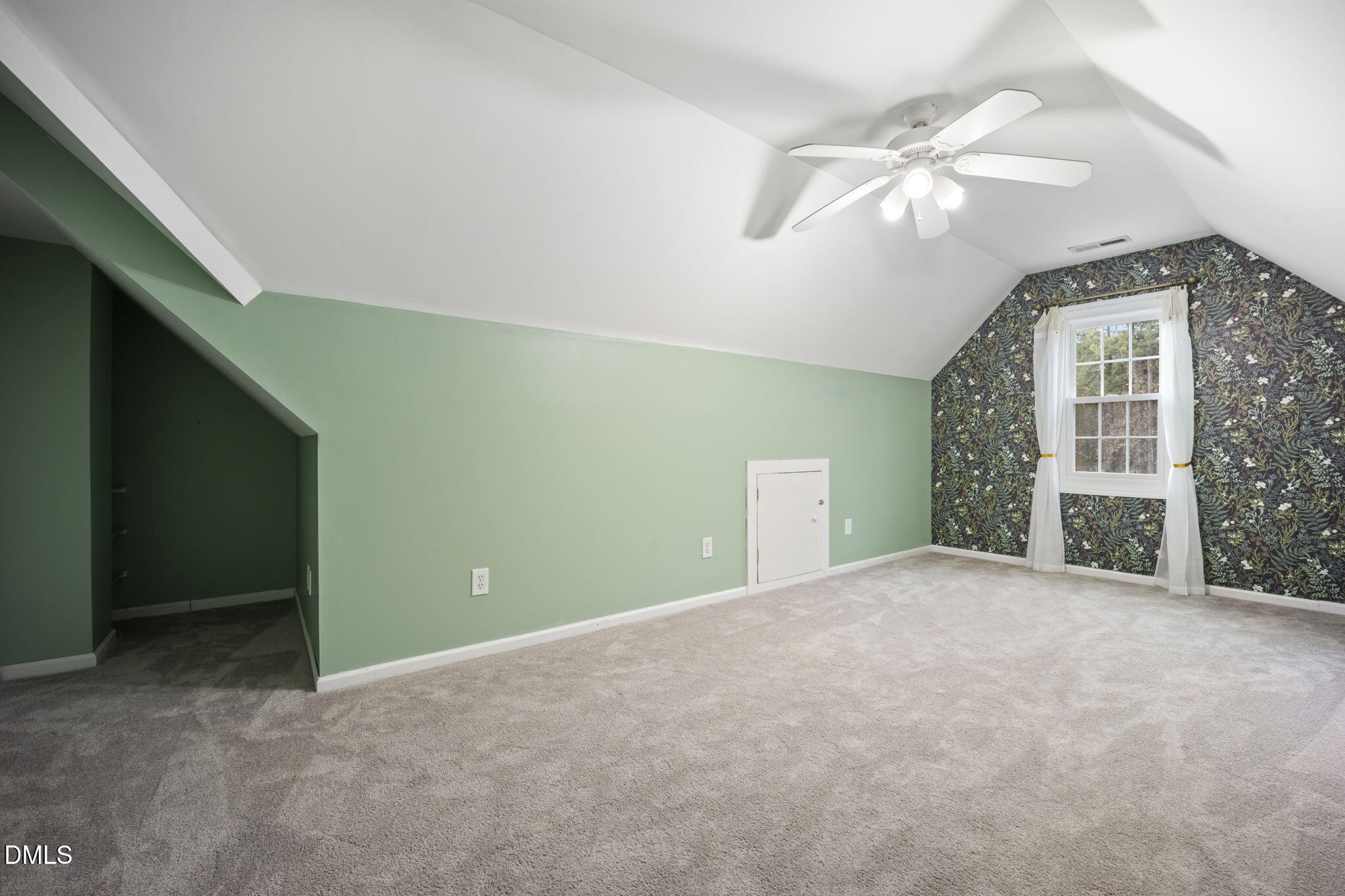 8665 Harps Mill Road Raleigh, NC 27615 - Photo 30 of 36 a view of a livingroom with a ceiling fan and window