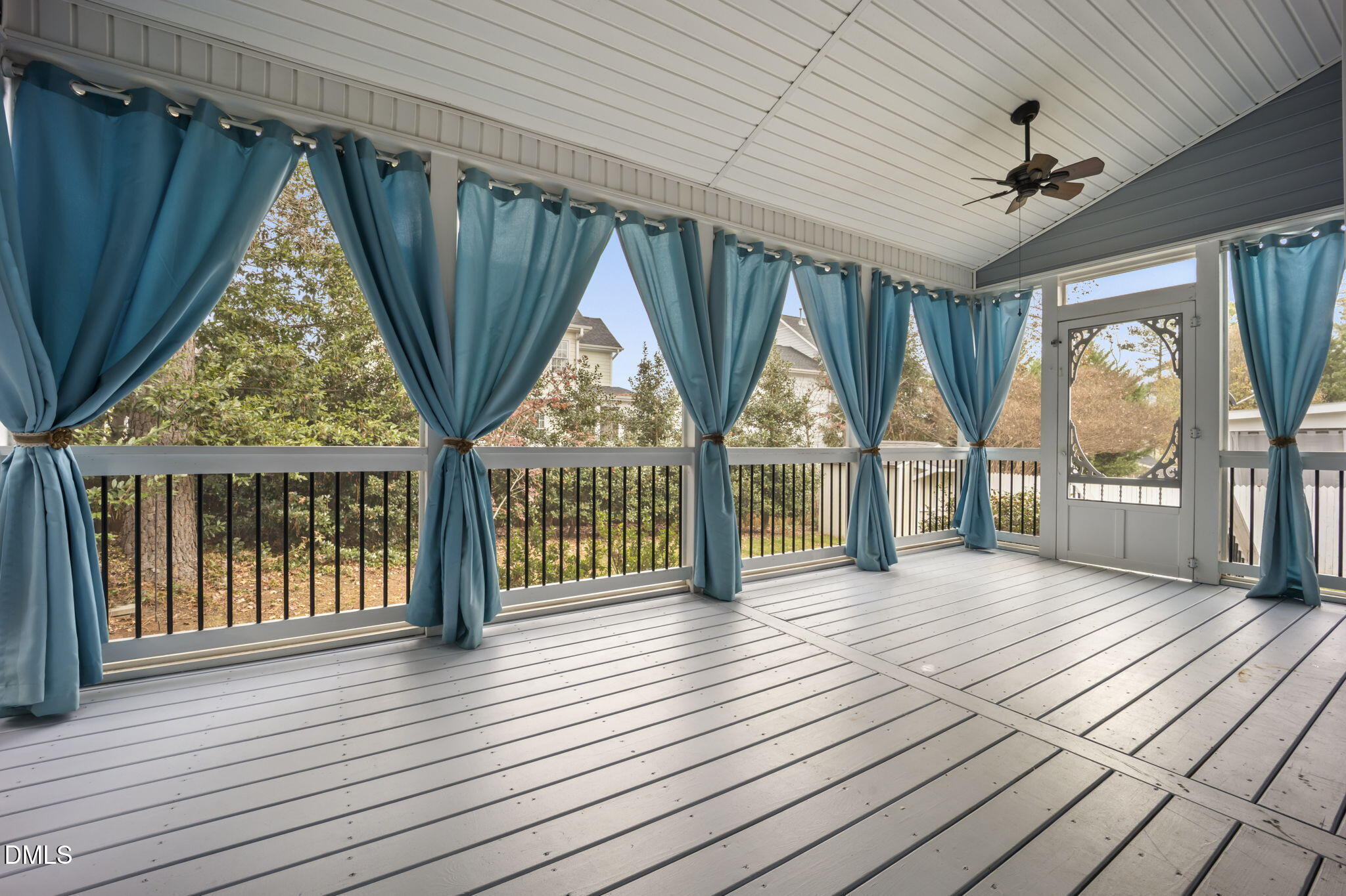 8665 Harps Mill Road Raleigh, NC 27615 - Photo 4 of 36 an empty room with wooden floor and windows