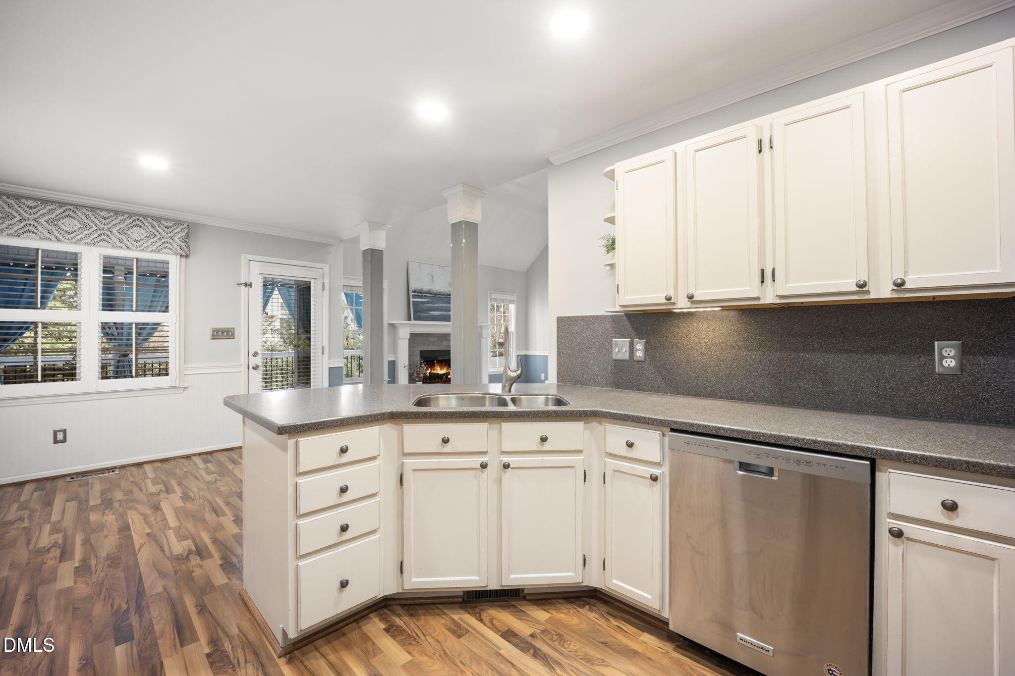 8665 Harps Mill Road Raleigh, NC 27615 - Photo 8 of 36 a kitchen with granite countertop white cabinets and sink