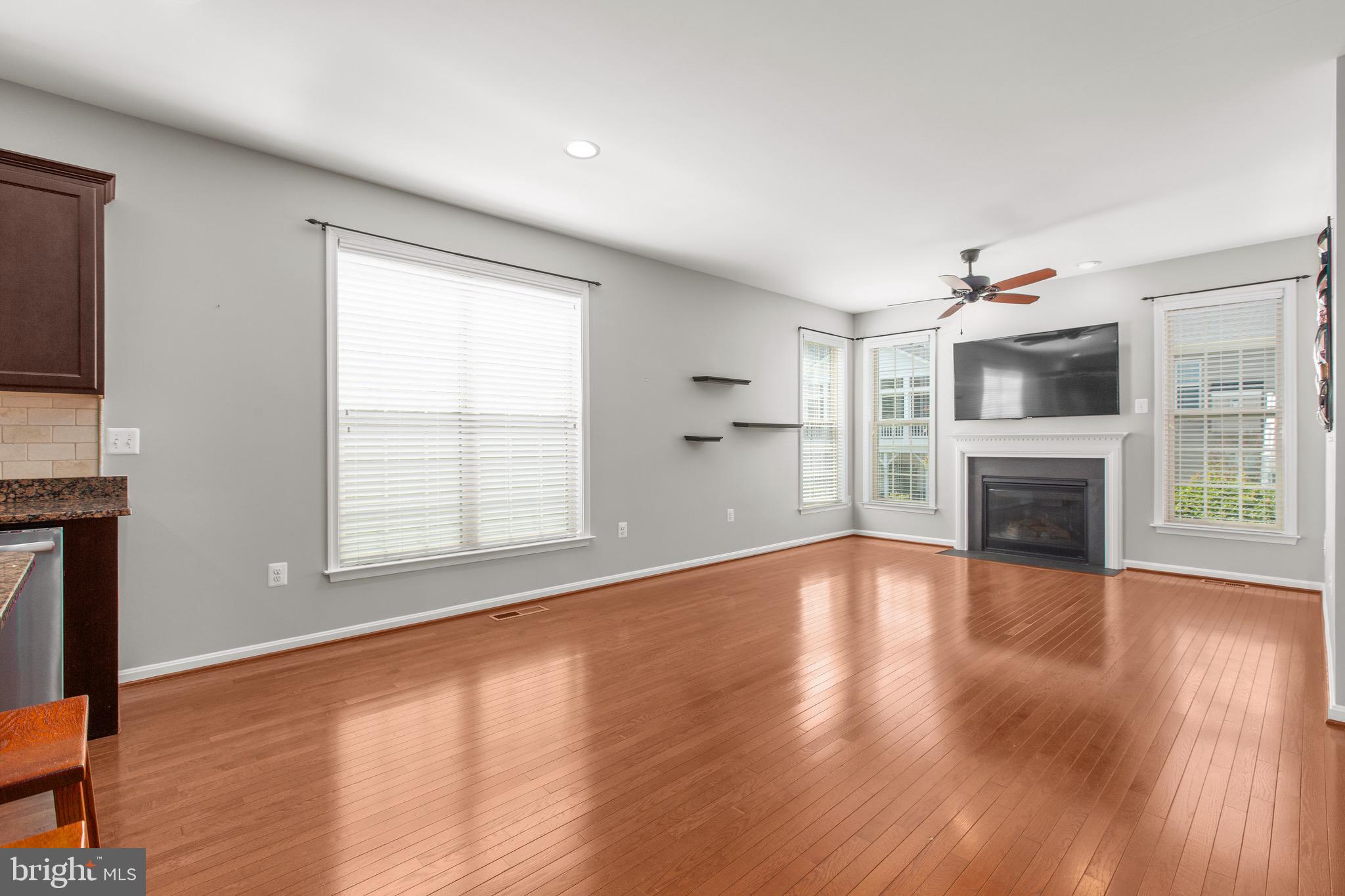 6016 East Greenbrier River Road Fredericksburg, VA 22407 - Photo 16 of 46 Family Room w/ Stunning Wood Floors & Gas Fireplac