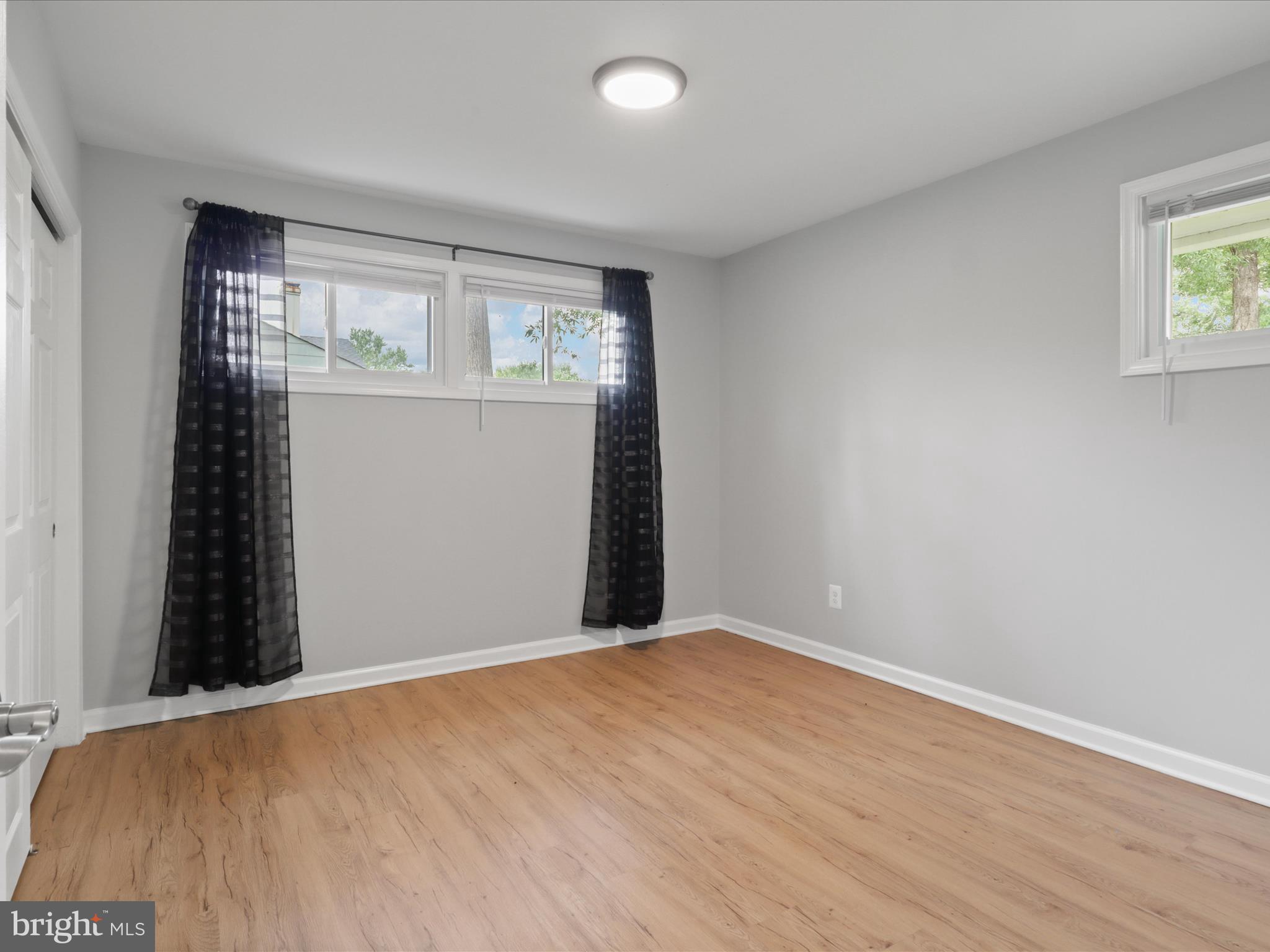 7435 Bath Street Springfield, VA 22150 - Photo 18 of 28 wooden floor in an empty room with a window