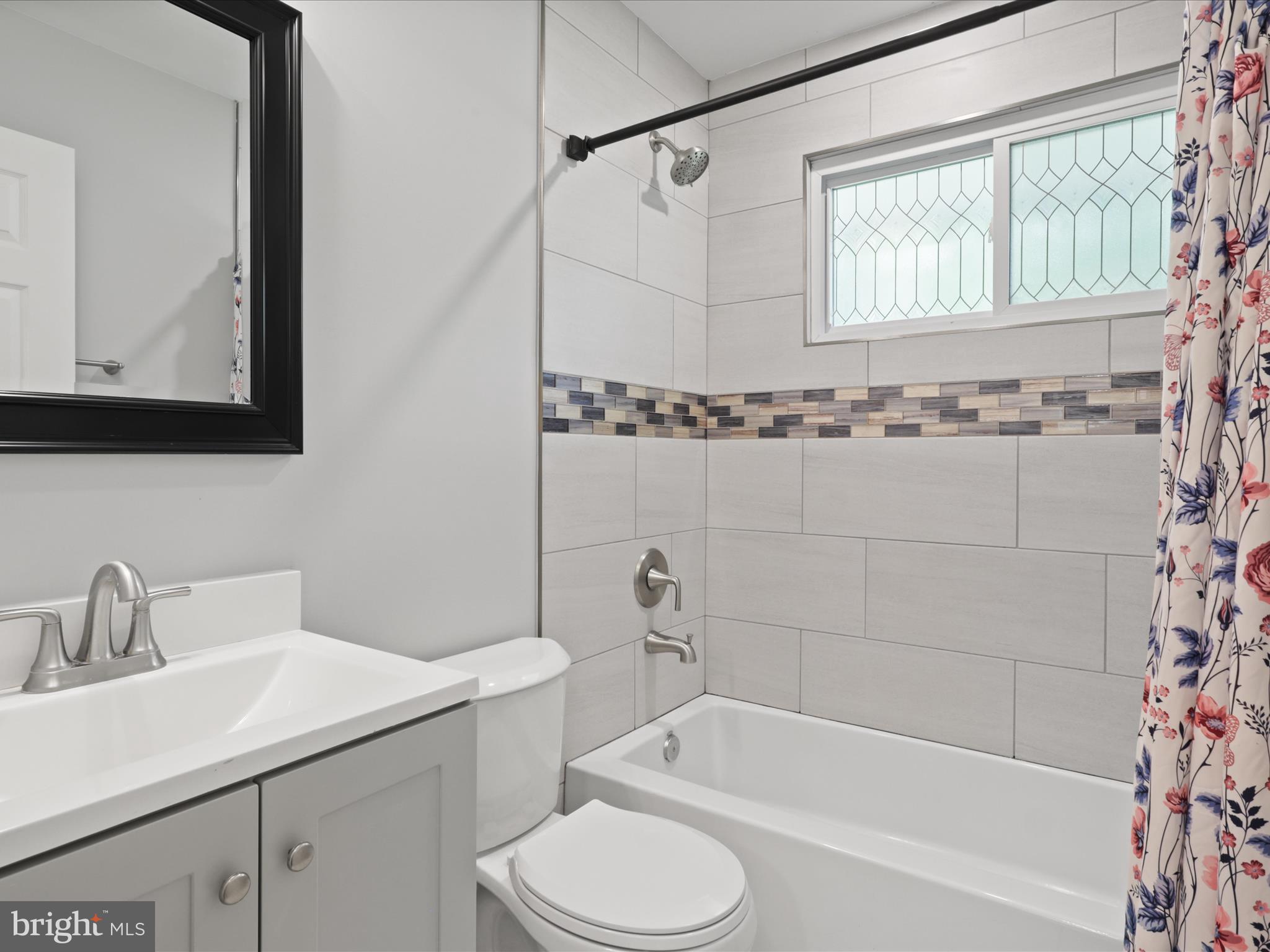 7435 Bath Street Springfield, VA 22150 - Photo 20 of 28 a bathroom with a sink toilet and shower