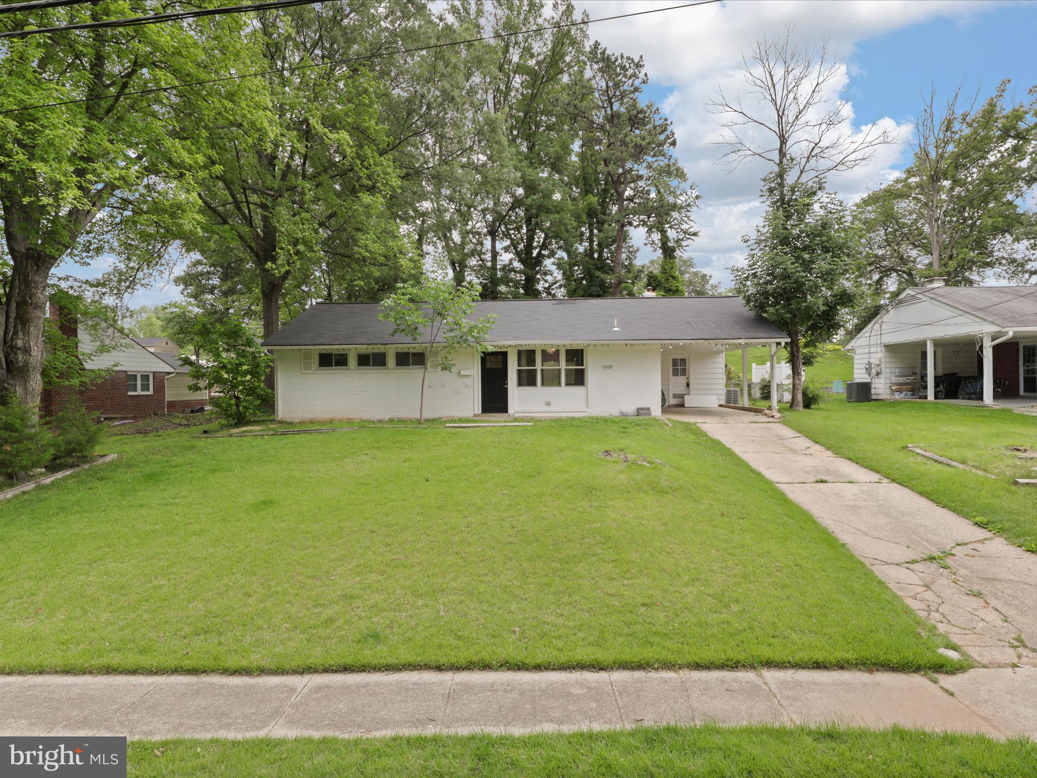 7435 Bath Street Springfield, VA 22150 - Photo 4 of 28 a house view with swimming pool in front of it