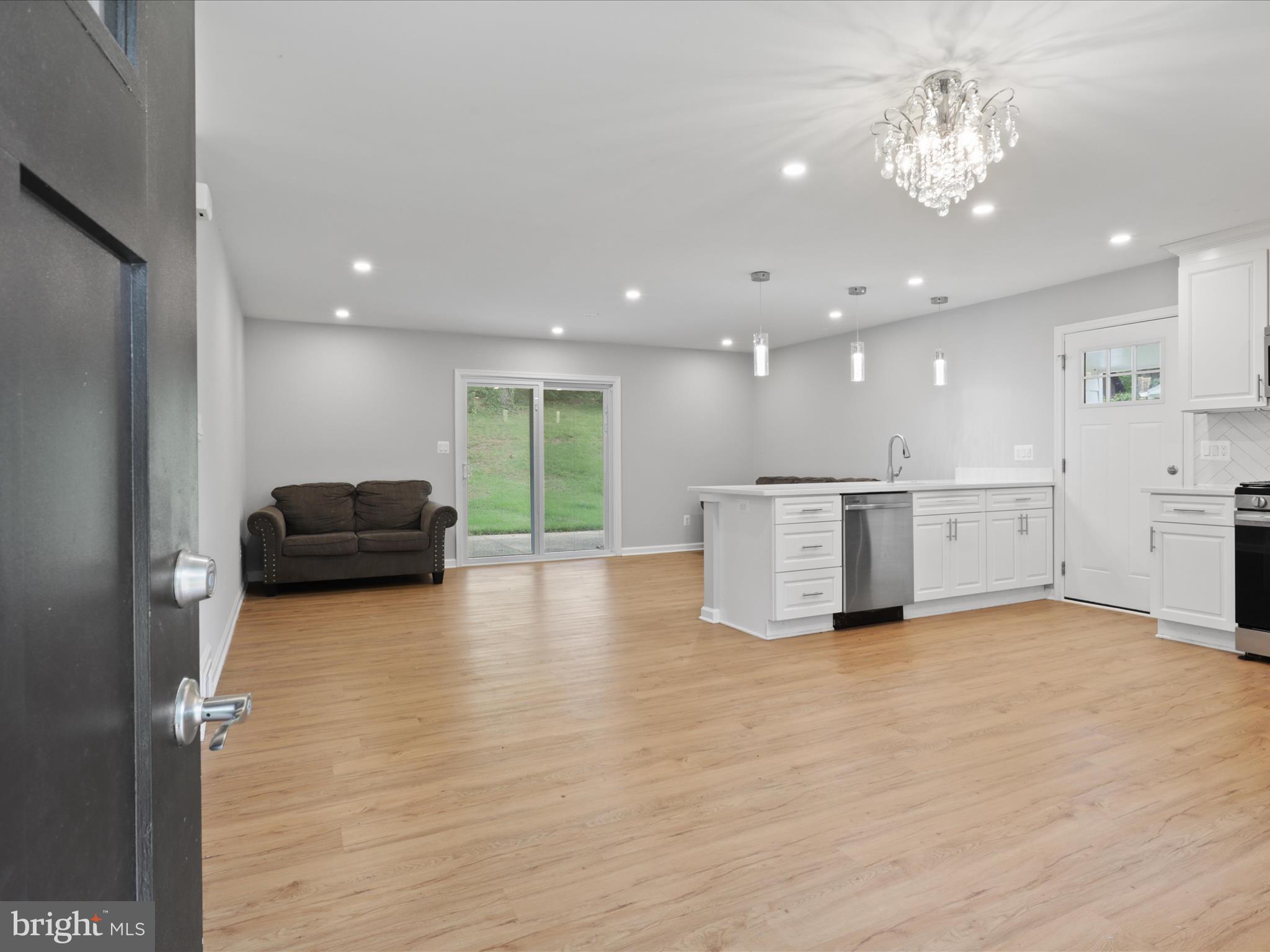 7435 Bath Street Springfield, VA 22150 - Photo 8 of 28 a view of a kitchen with a sink and a large window