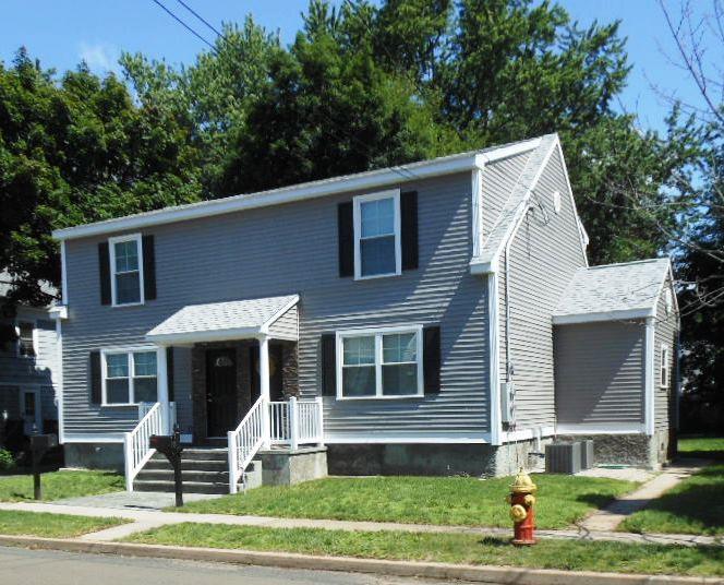 38 Wallace Row Wallingford, CT 06492 - Photo 1 of 1 a front view of a house with a yard