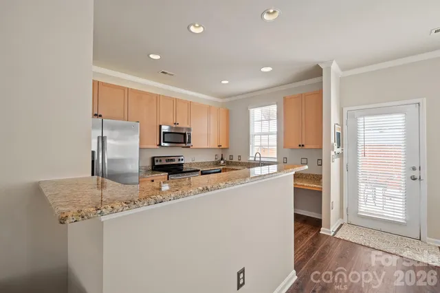 a kitchen with a refrigerator a stove a sink and a refrigerator