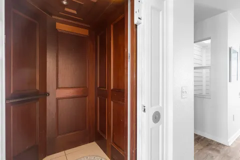 a bedroom with a bed a table and chair