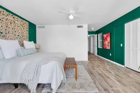 a bath room with a toilet and a shower