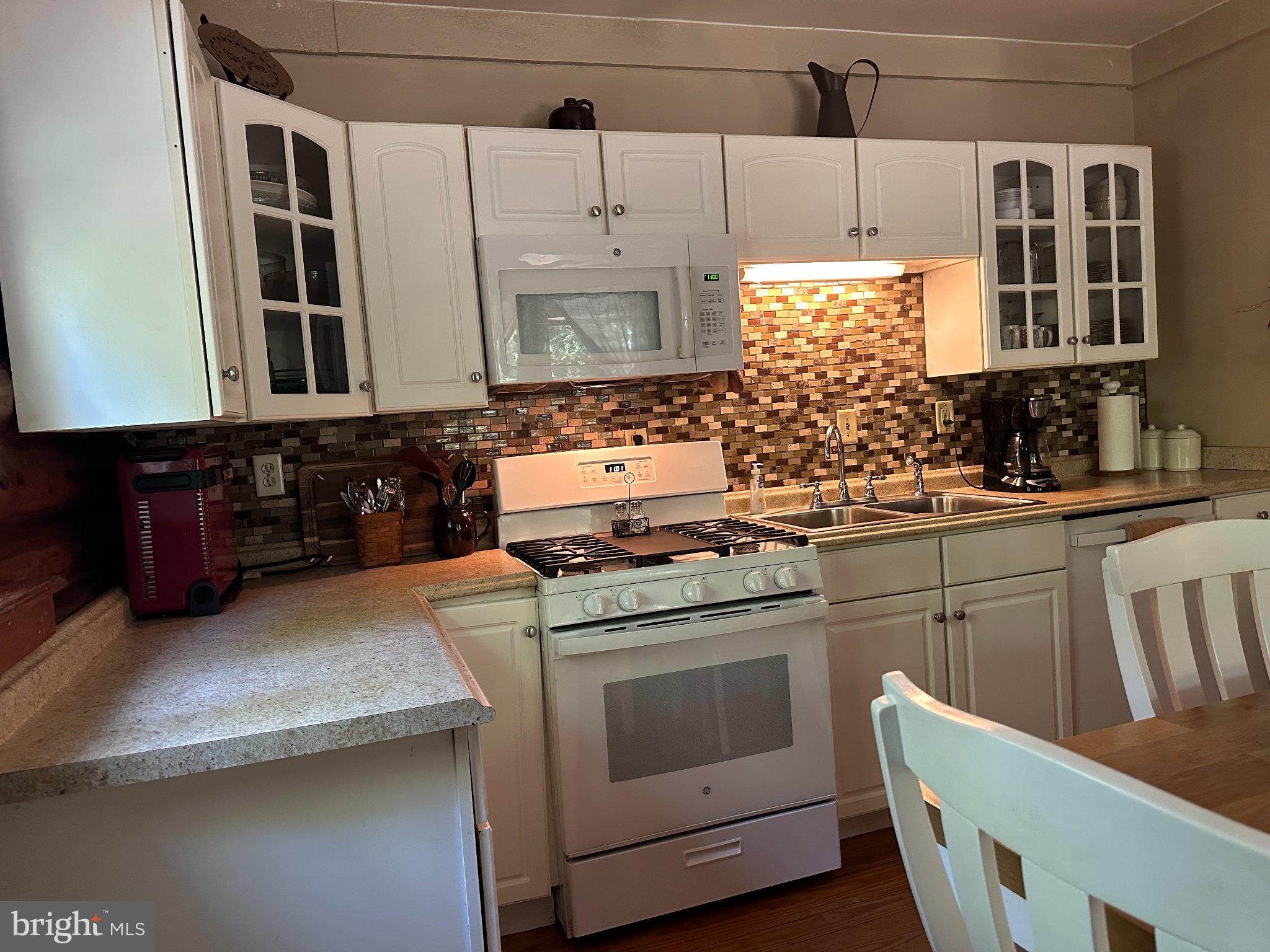 28407 Old Eden Road Eden, MD 21822 - Photo 23 of 48 a kitchen with a stove and a sink
