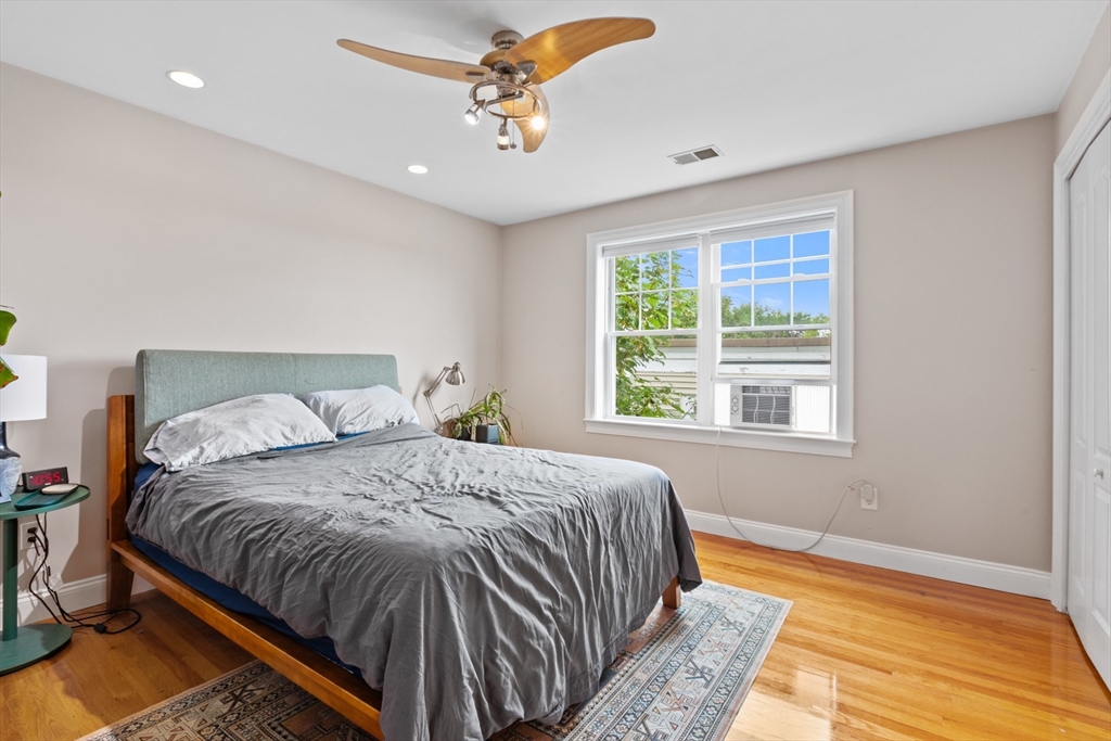 7 Fox Street, Unit 1 Boston, MA 02122 - Photo 14 of 24 a bedroom with a bed and a window