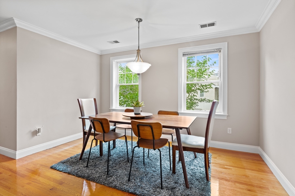 7 Fox Street, Unit 1 Boston, MA 02122 - Photo 8 of 24 a view of a dining room with furniture and window