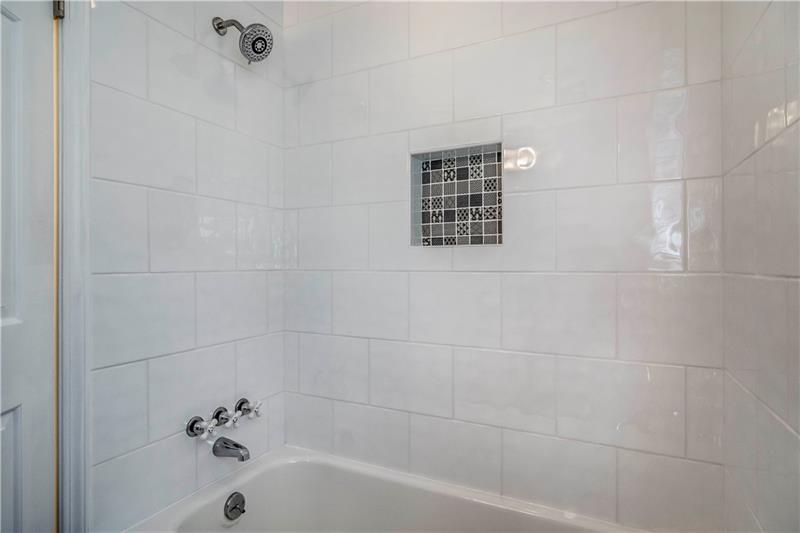 421 Manordale Road Pittsburgh, PA 15241 - Photo 22 of 25 Meticulous attention to detail was given when updating this tile surround shower/tub combo.