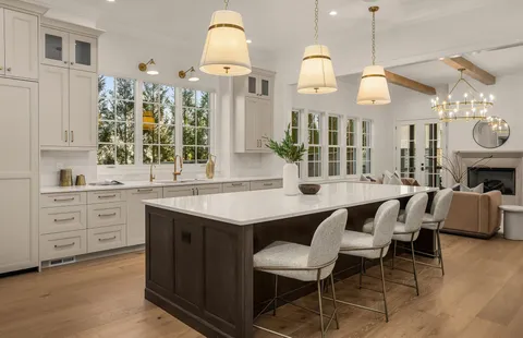 a view of a dining room with furniture and chandelier