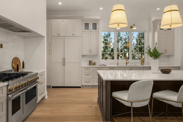 a spacious bathroom with a tub sink and mirror