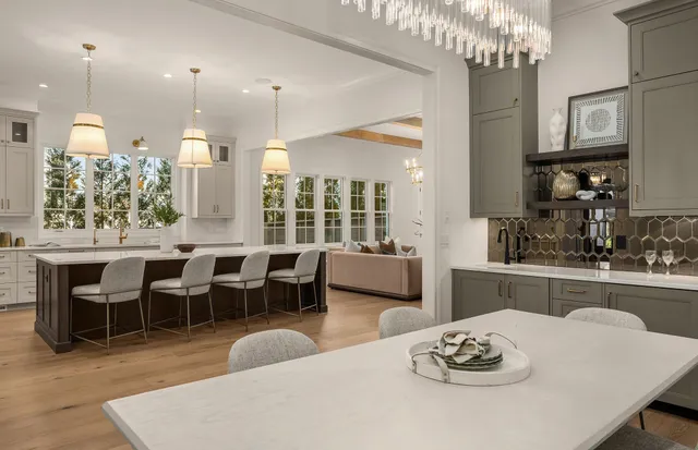 a view of a hallway with wooden floor and cabinet