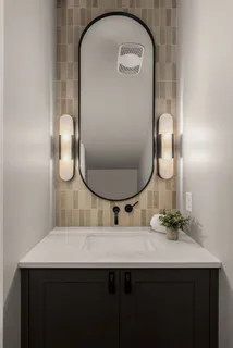 a living room with furniture a fireplace and a large window