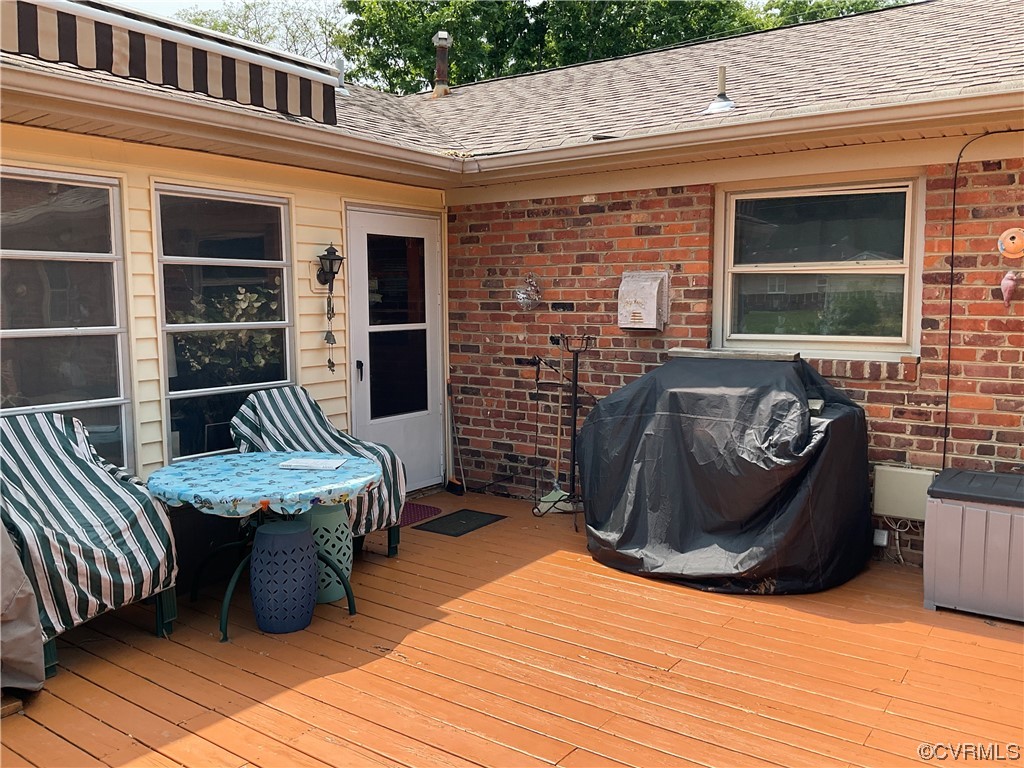 2801 Dancer Road Henrico, VA 23294 - Photo 2 of 5 a view of a patio with table and chairs with wooden floor and fence