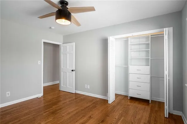 a view of room with window and ceiling fan