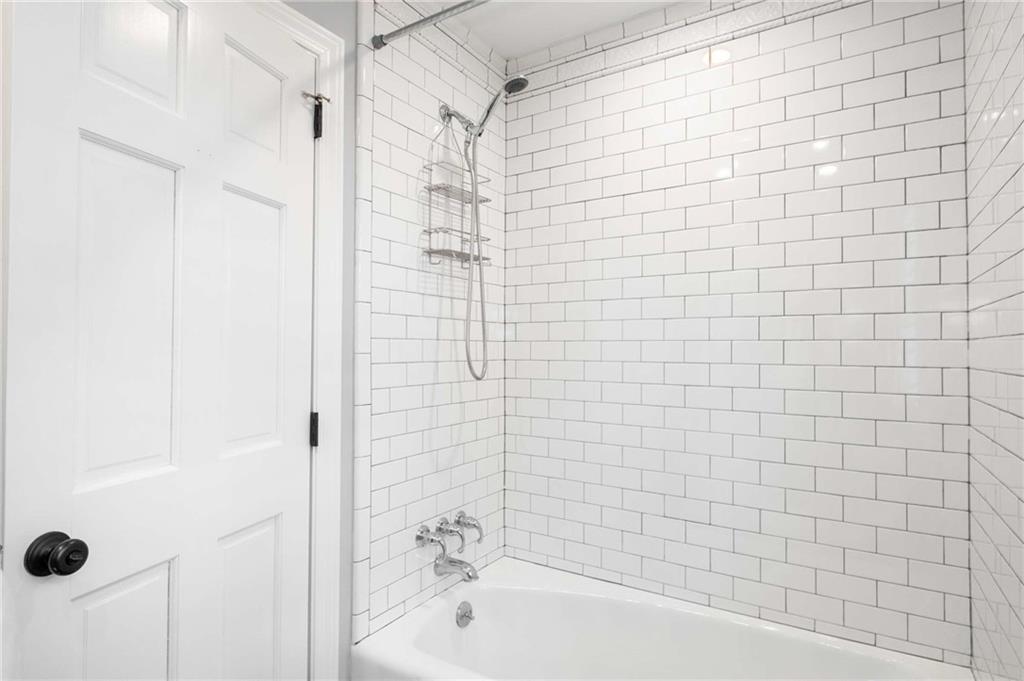 3240 Pinestream Road Northwest Atlanta, GA 30327 - Photo 24 of 42 a bathroom with a bathtub