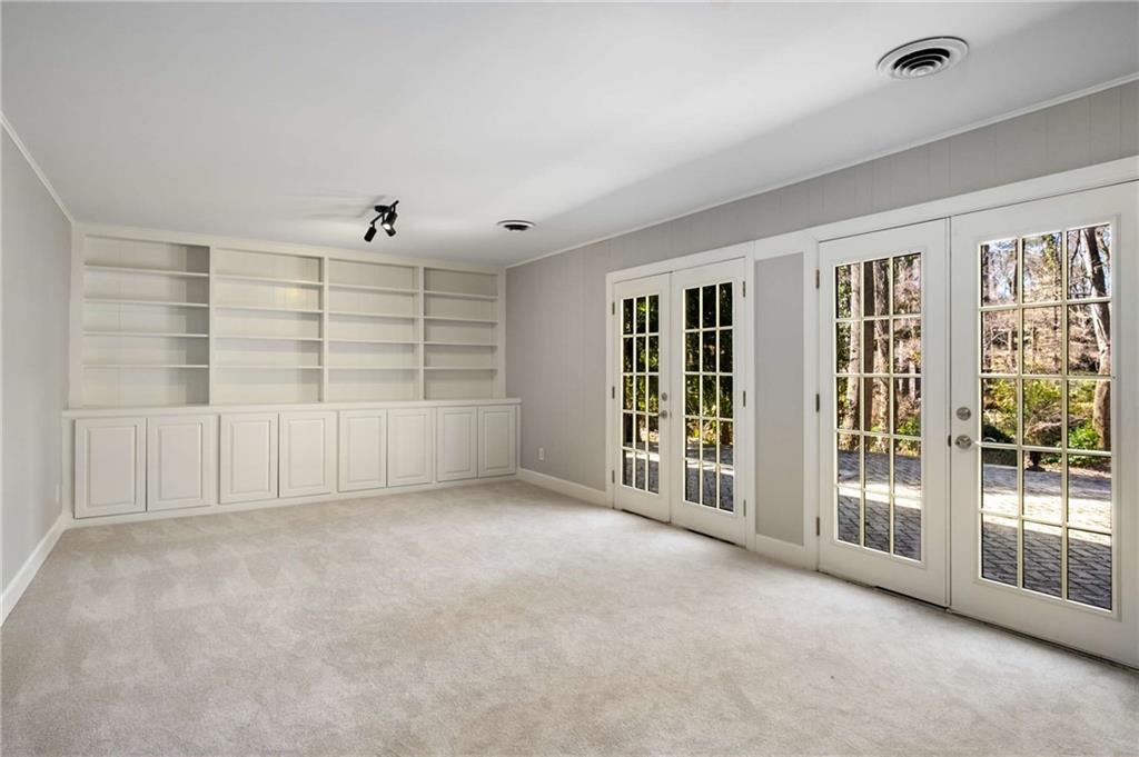 3240 Pinestream Road Northwest Atlanta, GA 30327 - Photo 28 of 42 a view of an empty room with a window