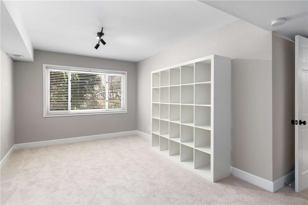 3240 Pinestream Road Northwest Atlanta, GA 30327 - Photo 32 of 42 a view of an empty room with a window