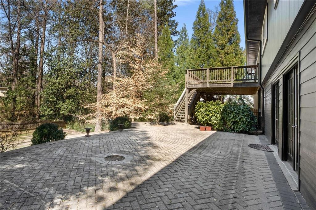 3240 Pinestream Road Northwest Atlanta, GA 30327 - Photo 36 of 42 a backyard of a house with large trees