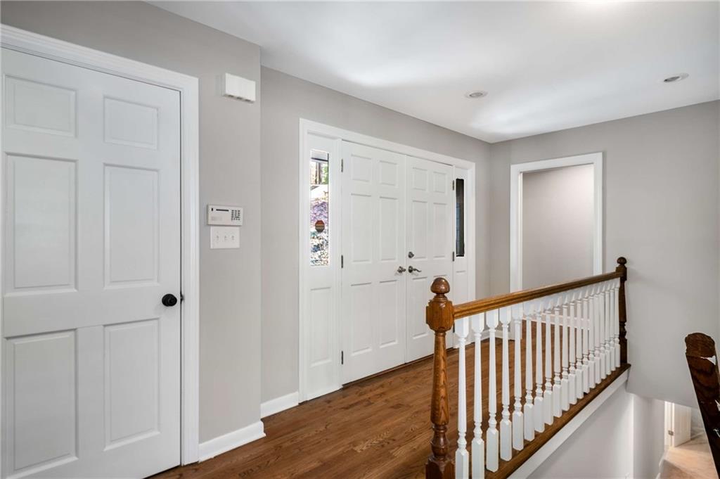 3240 Pinestream Road Northwest Atlanta, GA 30327 - Photo 4 of 42 a view of a hallway with wooden floor and entryway