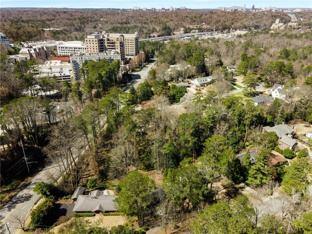 3240 Pinestream Road Northwest Atlanta, GA 30327 - Photo 41 of 42 an aerial view of residential house with parking and trees