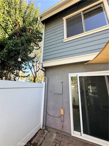 a view of a house with a tree
