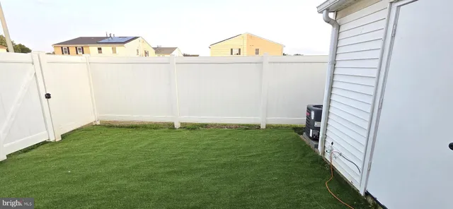 a view of a backyard with pathway