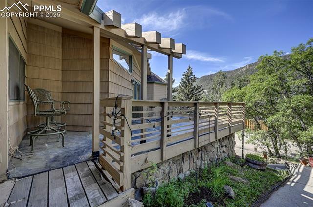 4665 Fox Road Cascade, CO 80809 - Photo 6 of 50 Entry off the front walk way to the front yard deck.