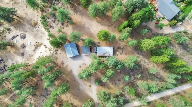 a spacious bedroom with a bed and a chandelier