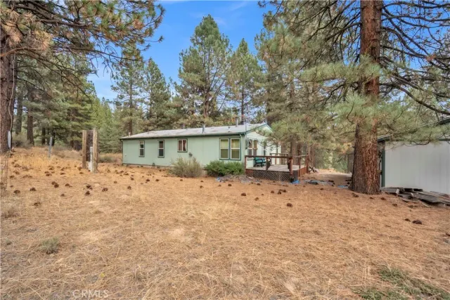 a view of a house with a snow in the yard